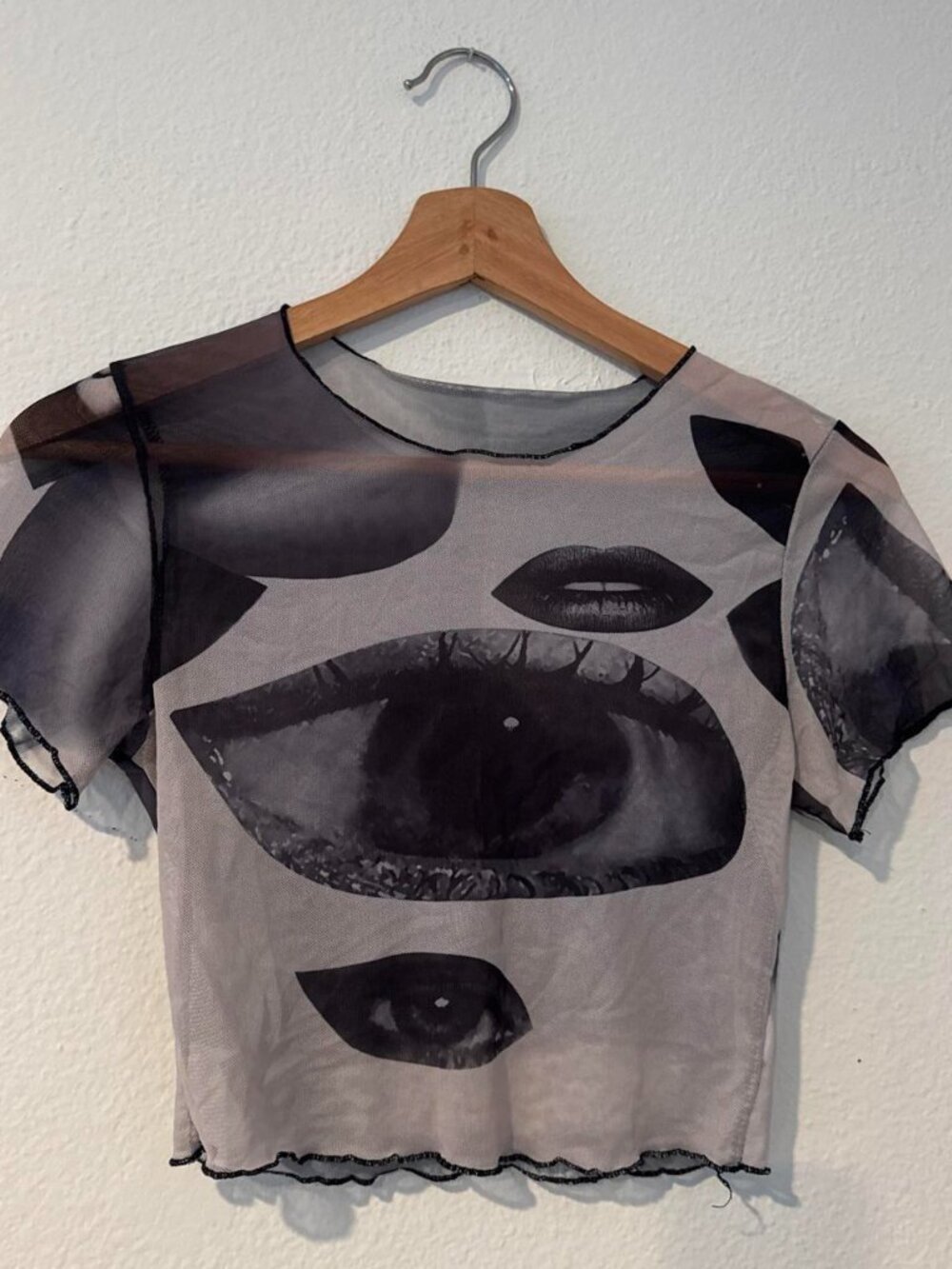Gray & black mesh crop top with graphic of eyes and lips